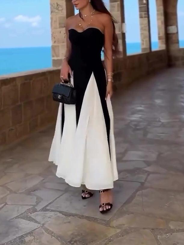 Robe longue bustier noir et blanc, idéale pour soirée élégante ou plage, avec sac à main et sandales