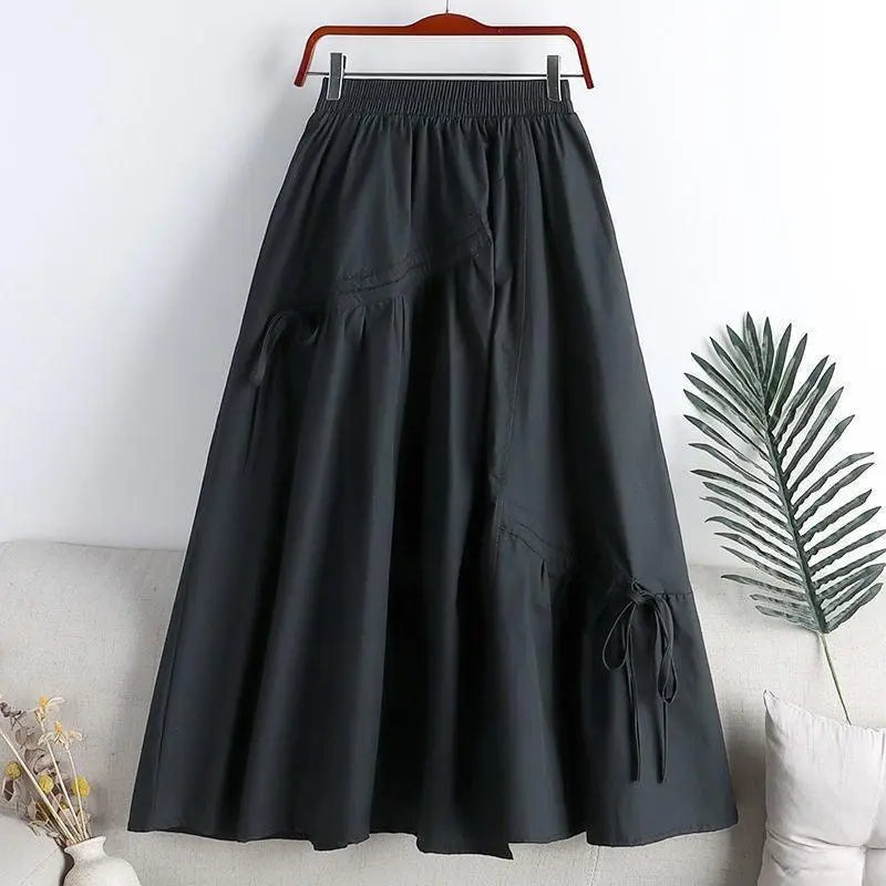 Jupe longue noire taille élastiquée avec poches et liens, style féminin élégant pour toutes les occasions