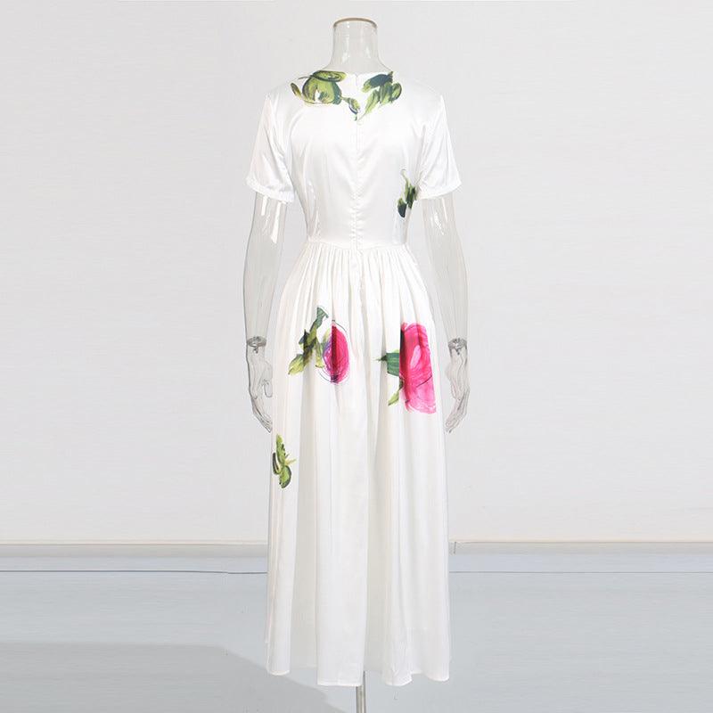 Robe bohème blanche à imprimé floral rose et vert, manches courtes, taille élastiquée, style féminin élégant