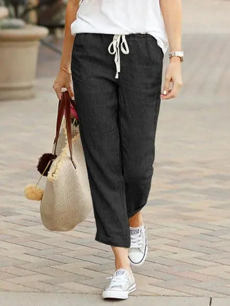 Pantalon noir ample femme avec cordon, idéal pour look décontracté et tendance