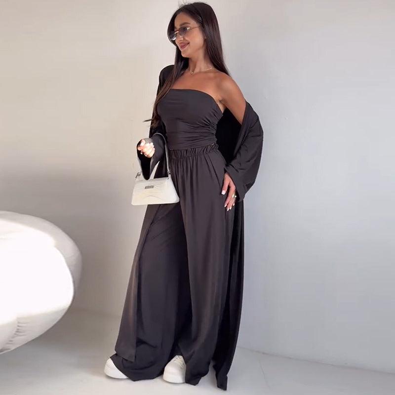 Robe longue noire asymétrique avec manches larges, style élégant et moderne pour femme