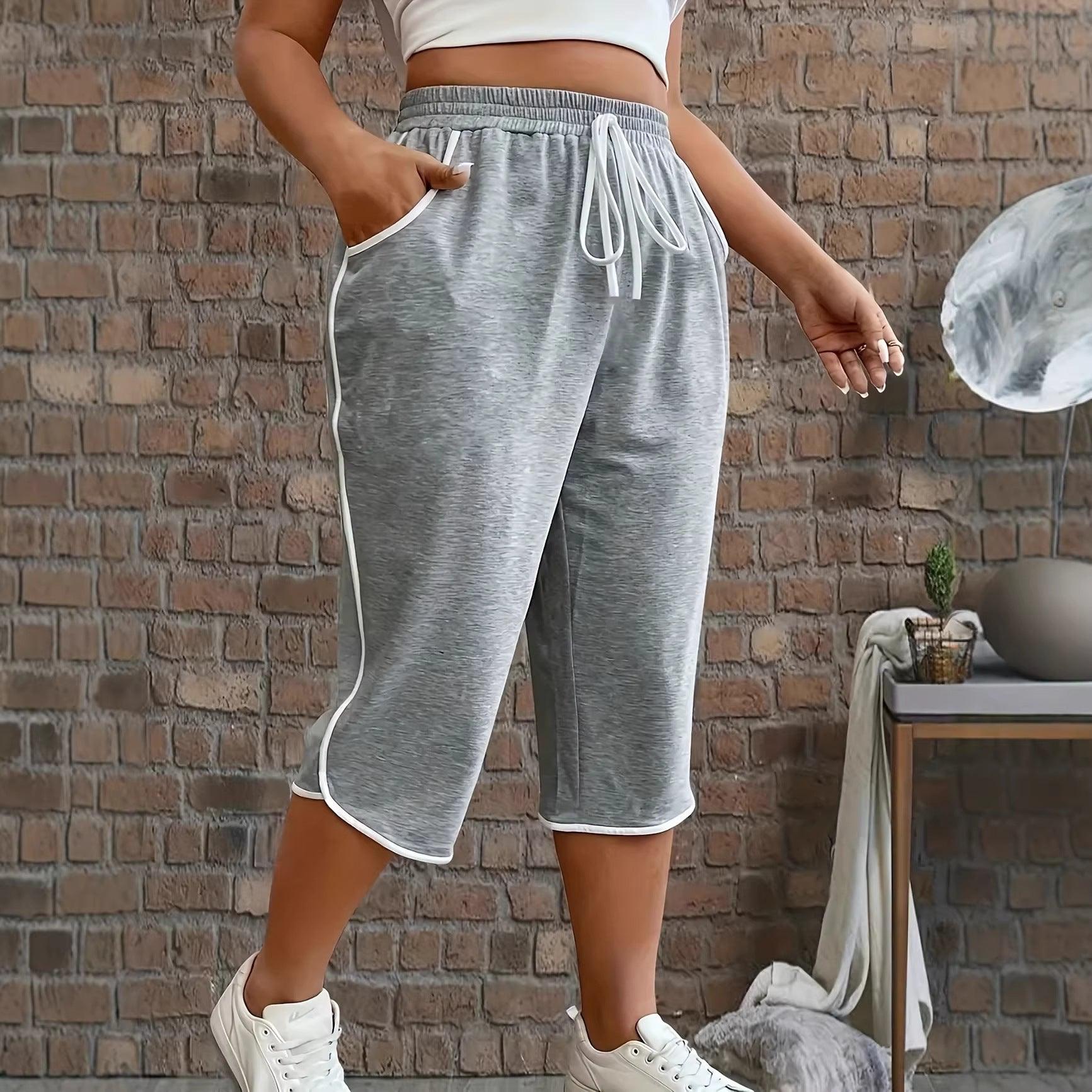 Pantalon court gris femme avec cordon blanc et poches, style décontracté et confortable