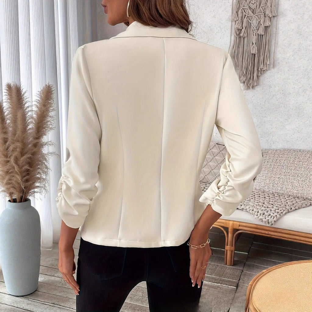 Blouse féminine crème à manches bouffantes, vue dos, style élégant pour tenue quotidienne ou bureau