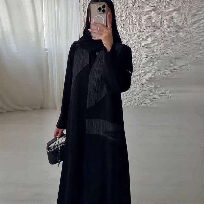 Robe longue noire élégante à manches longues, style féminin avec détails plissés, tenue chic pour toutes occasions
