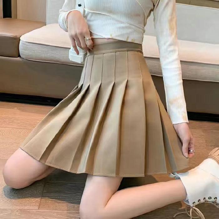 Jupe plissée beige élégante, style féminin, parfait pour les looks mode quotidien ou décontractés.