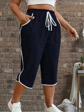 Pantalon court féminin bleu marine à rayures blanches, taille élastique avec cordon, style décontracté