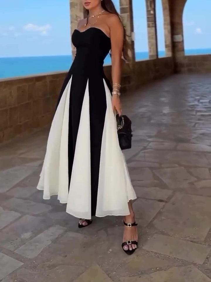 Robe longue noire et blanche élégante pour femme, idéale pour soirée ou événement chic près de la mer